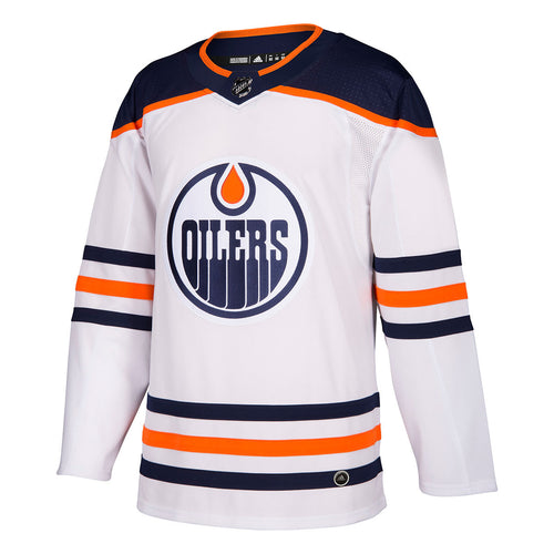 Front view of a white Edmonton Oilers road/away jersey with large Oilers logo on center of chest, navy shoulders, and navy and orange stripes on sleeves and bottom hem.