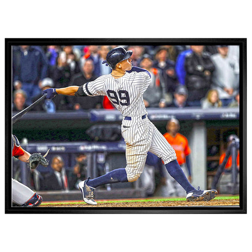 Aaron Judge of the  New York Yankees swinging bat image on stretched canvas with black float frame.