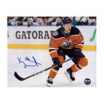 Kailer Yamamoto Edmonton Oilers skating during an NHL hockey game wearing orange jersey. Photo is signed in the lower left corner. 