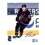 Signed photo of Ryan Nugent-Hopkins skating during an NHL game, wearing navy alternate Edmonton Oilers jersey with alternate captain's "A" on left chest.