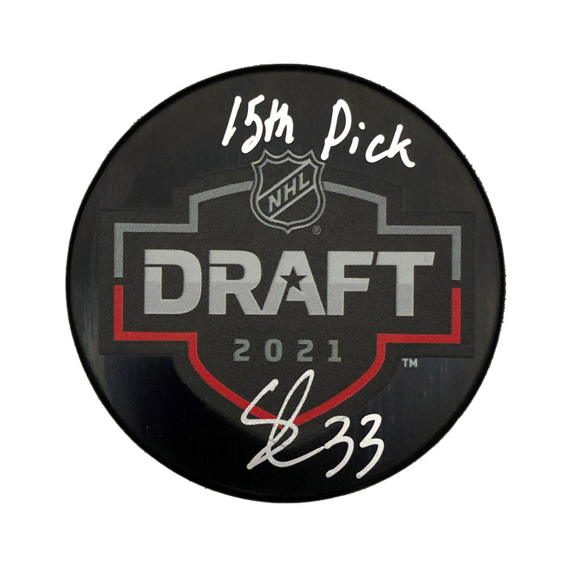 Black NHL hockey puck with 2021 NHL draft design. Puck is signed by Sebastian Cossa with inscription "15th pick"